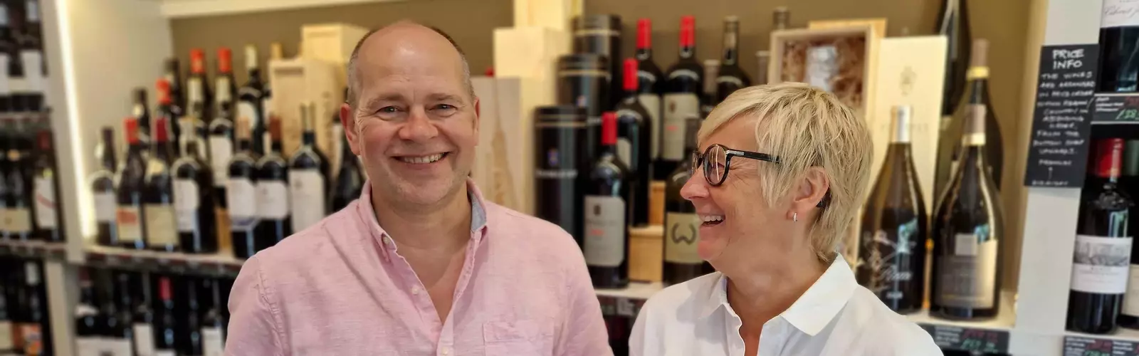 Tim and carol smiling on the shop floor